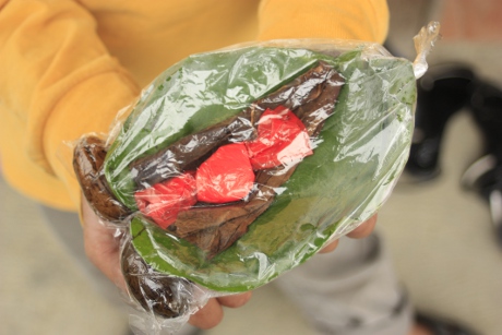What you get for 5 pesos: 4 vine leaves, 1 Tobacco leaf, 2 Betel nuts, 1 small bag of lime, WARNING: Lime is extremely corrosive and needs to be handled delicately.