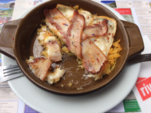 Salanfe, CH - Swiss Lunch Goatheard's Rosti with Bacon - grated potato cakes topped with cheese & bacon along Lac de Salanfe (Ian Yacobucci\Borderless Travels)